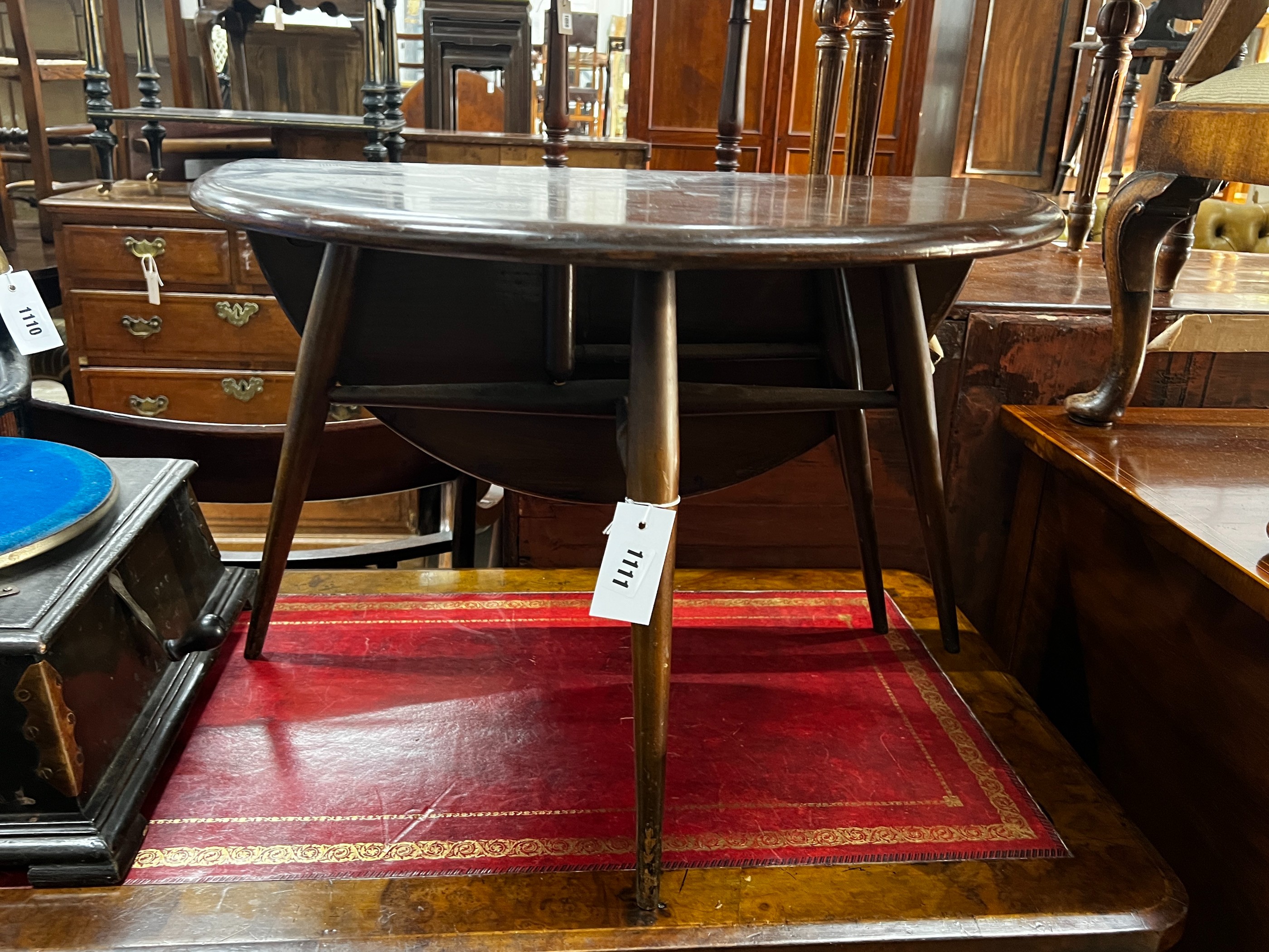 An Ercol elm single drop flap occasional table, width 61cm, height 40cm